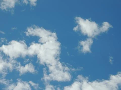 Blue sky with white clouds full frame Stock Photos