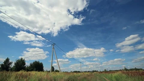 Blue sky white clouds over the field. Fluffy white cloud. Cumulus cloud nature Stock Footage 202620515