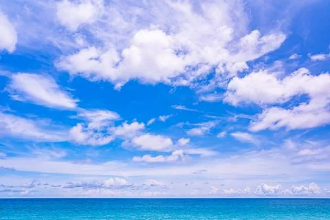 Blue sky white clouds over sea nature background Stock Photos