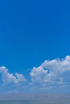 Blue sky with white clouds over distant horizon Stock Photos