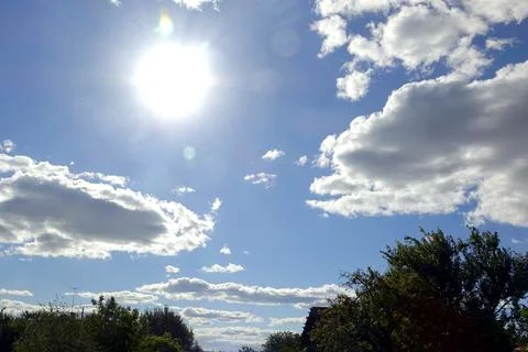Blue Sky With White Clouds Over a Peaceful Countryside During a Sunny Day Stock Photos