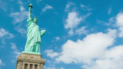 Blue Sky White Clouds Panning into Statue of Liberty Stock Footage 39377912