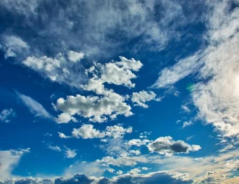 A blue sky with white clouds Stock Photos