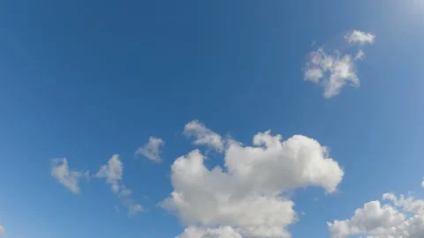 Blue sky white clouds. Puffy fluffy white clouds. Summer blue sky time lapse. Stock Footage 153099348
