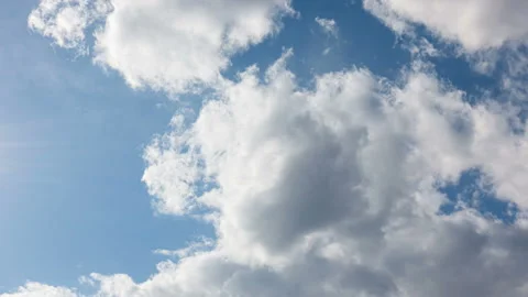 Blue sky with white clouds. Puffy fluffy white clouds. Cumulus clouds. White Stock Footage 153423252