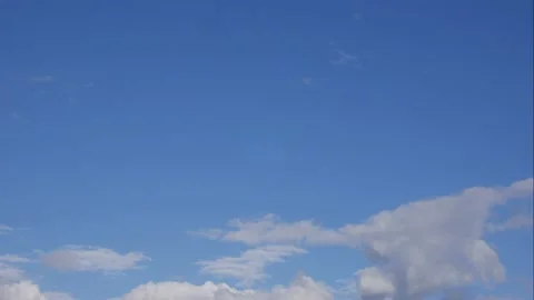 Blue sky white clouds. Puffy fluffy white clouds. Cumulus cloud scape timelapse Stock Footage 154354466