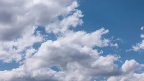 Blue sky with white clouds. Puffy fluffy white clouds. Cumulus clouds. White Stock Footage 195212510