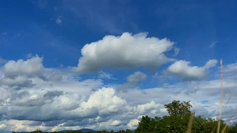 Blue sky white clouds. Puffy fluffy white clouds. Cumulus cloud timelapse. Stock Footage 219060537