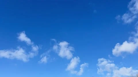 Blue sky white clouds. Puffy fluffy white clouds. Cumulus cloud cloudscape time Stock Footage 235134106