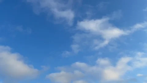 Blue sky white clouds. Puffy fluffy white clouds. Cumulus cloud cloudscape time Stock Footage 237704035