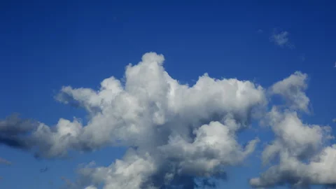 Blue sky white clouds. Puffy fluffy white clouds. Cumulus cloud cloudscape Stock Footage 315309711