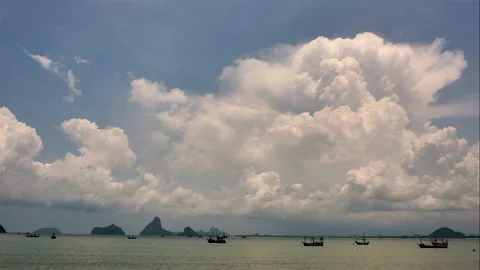 Blue sky white clouds on the sea. Puffy fluffy white clouds on the sea. Stock Footage 240692934
