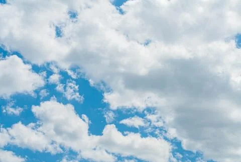 Blue sky with white clouds. Sky background. Photos