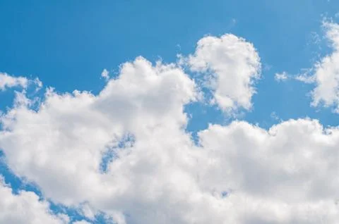Blue sky with white clouds. Sky background. Фото