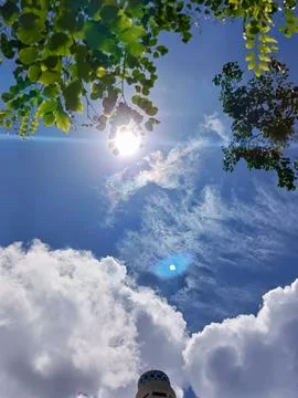 Blue sky with white clouds. The sky is clear and bright, and the clouds are scat Stock Photos