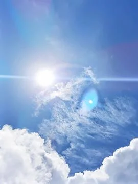 Blue sky with white clouds. The sky is clear and bright, and the clouds are scat Stock Photos