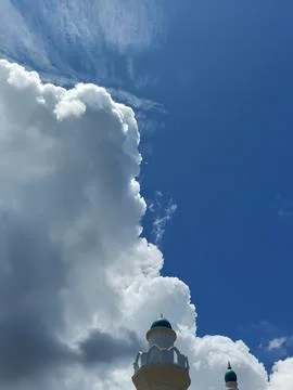 Blue sky with white clouds. The sky is clear and bright, and the clouds are scat Stock Photos