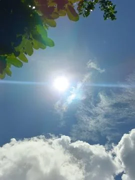 Blue sky with white clouds. The sky is clear and bright, and the clouds are scat Stock Photos