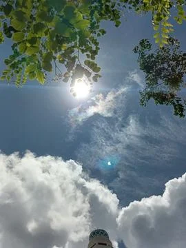 Blue sky with white clouds. The sky is clear and bright, and the clouds are scat Stock Photos