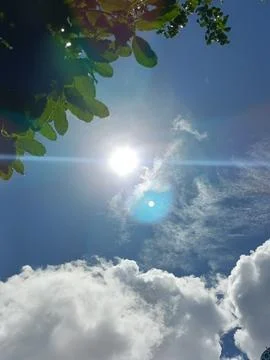 Blue sky with white clouds. The sky is clear and bright, and the clouds are scat Foto stock