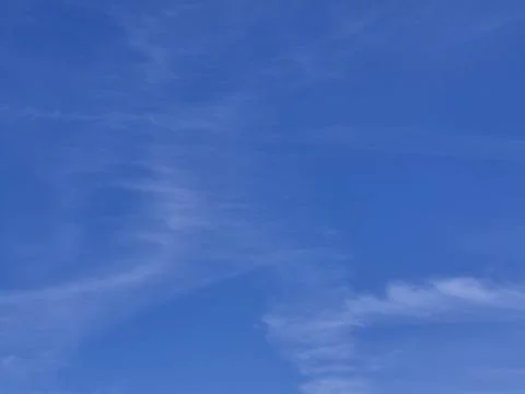Blue sky with white clouds. The sky is clear and bright, and the clouds are.. Stock Photos