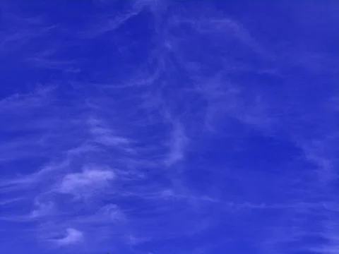 Blue sky with white clouds. The sky is clear and bright, and the clouds are.. Stock Photos