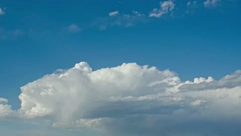 Blue sky white clouds - slowly fluttering clouds in the sky - time lapse Stock Footage 233804342