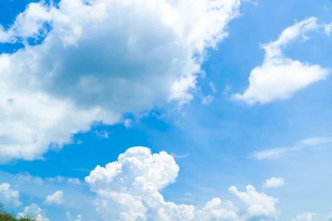 Blue sky with white clouds spreading on a sunny day Stock Photos