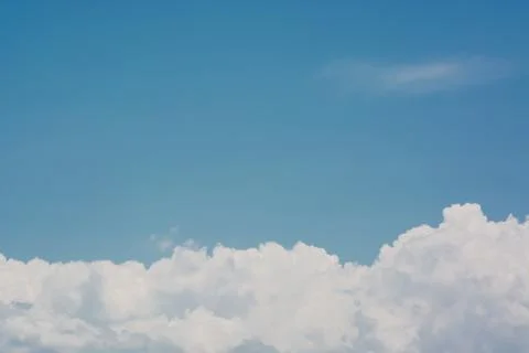 Blue sky with white clouds. Summer background Фото