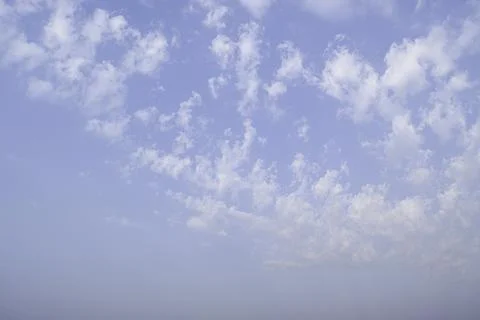 Blue sky with white clouds on summer day background. Stock Photos