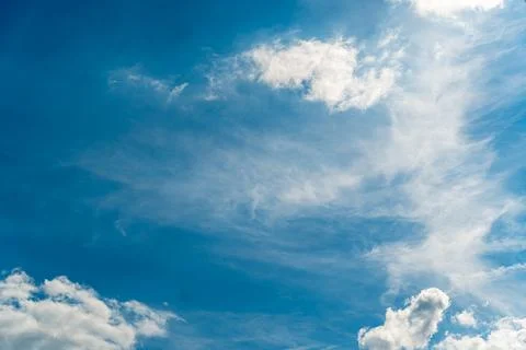 Blue sky with white clouds on sunny day, wispy cirrus and fluffy cumulus cloud Stock Photos
