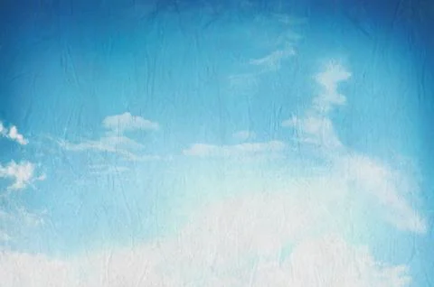 Blue sky with white clouds on texture paper Ilustração Stock