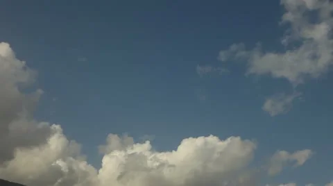 Blue sky with white clouds time lapse Stock Footage 12744357