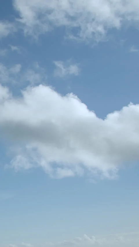 Blue sky with white clouds time-lapse. Vertical video. Stock Footage 239767615