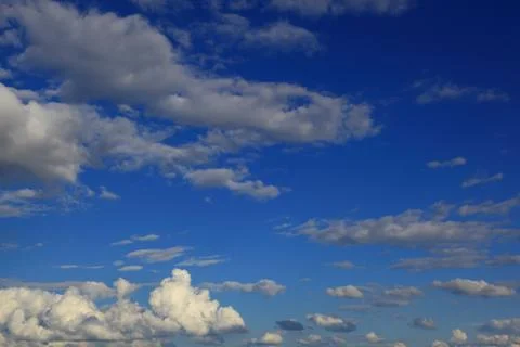 Blue sky with white cumulus clouds. Stock Photos