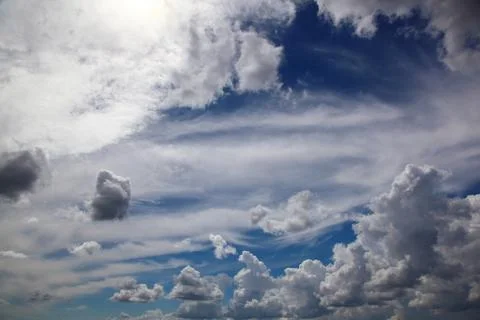 Blue sky with white cumulus clouds. Stock Photos