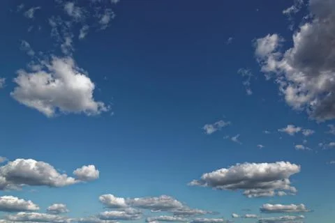 Blue sky with white cumulus clouds. Stock Photos