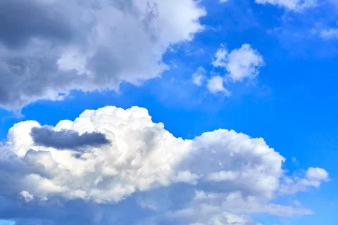 Blue sky with white cumulus clouds. Banner. Background. Nature wallpaper. Stock Photos