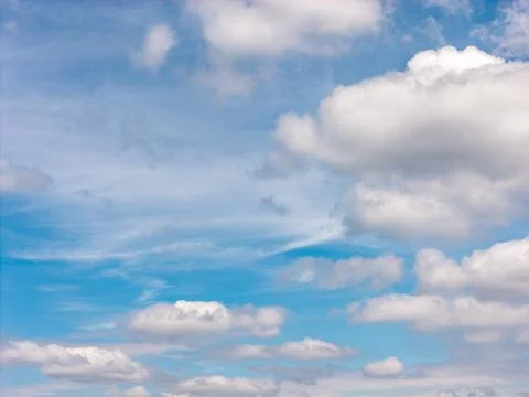 Blue sky with white cumulus clouds on a clear day Фото