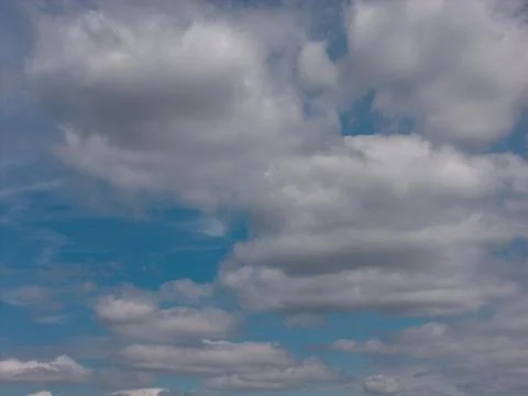 Blue sky with white cumulus clouds Stock Photos