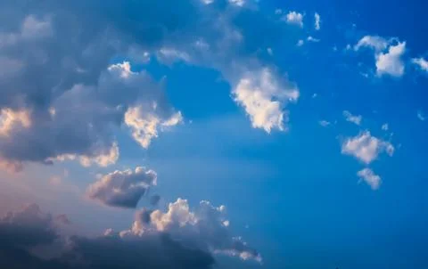 Blue Sky With White &amp; Dark Clouds Stock Photos