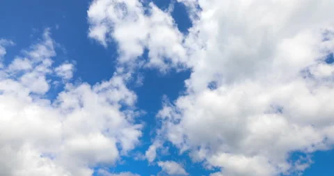 Blue sky with white fluffy clouds 4K timelapse Stock Footage 140018987