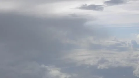 Blue sky with white fluffy clouds from airplane flight fly over the clouds .. Stock Footage 246470055