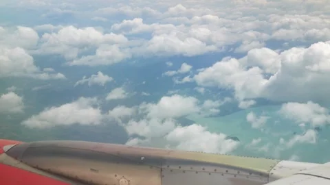 Blue sky with white fluffy clouds from airplane flight fly over the clouds .. Stock Footage 304098084