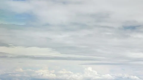 Blue sky with white fluffy clouds from airplane flight fly over the clouds .. Stock Footage 309628606