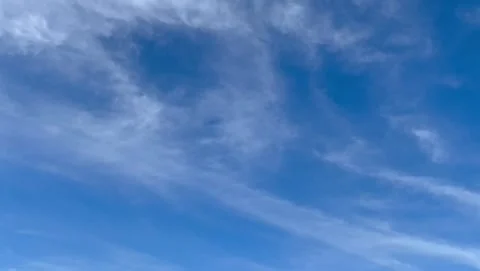 Blue Sky with White Fluffy Clouds Moving Slowly 動画素材 332454657
