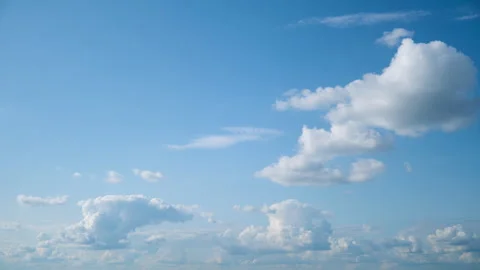 Blue sky with white fluffy clouds. Bright sunny day with clear atmosphere and Stock Footage 341511238