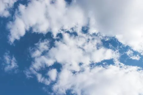 Blue sky with white fluffy clouds. Beautiful cloudscape. Sunny day Stock Photos