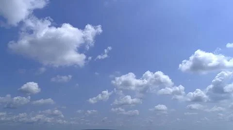 Blue Sky with White Fluffy Clouds Stock Photos