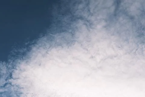 Blue sky with white fluffy clouds, beautiful dark heaven Stock Photos